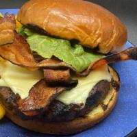 Classic Burger · 1855 Angus Beef Patty, Mayo, Lettuce, Tomato, Onion and Cheddar on a Brioche Bun. Served wit...