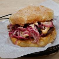 Pork Confit Sandwich · Pork Confit, Sweet Potato, Pickled Onions, Spicy Mayo on a Ciabatta Roll