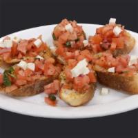 Bruschetta · Onion, tomato, garlic, parsley, parmesan cheese & olive oil over toasted Italian bread.