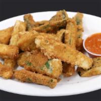 Fried Zucchini · Zucchini sticks dipped in an egg mixture with bread crumbs, parmesan cheese, baking powder, ...