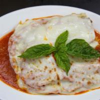 Lasagna  · Lasagna topped with classic cheese, tomato sauce, and ground beef.