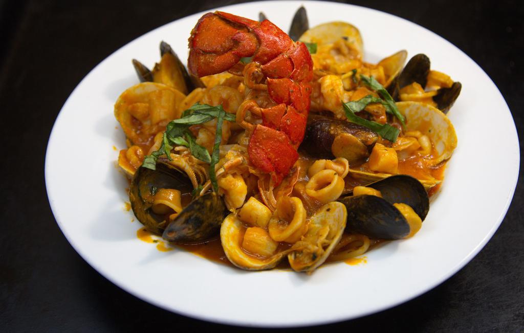 Mario'S Seafood Combo · Clams, lobster, shrimp, scallops, mussels, calamari & marinara sauce (served with your choice of spaghetti, linguini or salad).
