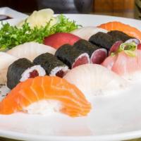 Nigiri Sushi Deluxe · 9 pieces of assorted fish on seasoned rice and 1 tuna roll. With soup and salad, sashimi com...