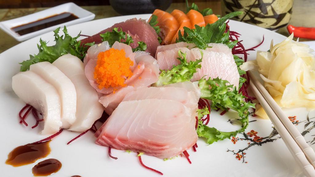 Sashimi Deluxe · 20 pieces of sashimi. With soup and salad, sashimi comes with a bowl of white rice.