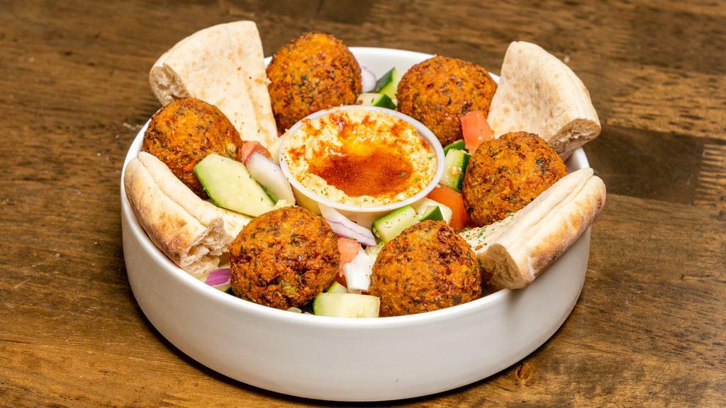Falafel Plate · Large. Homemade hummus, Israeli salad, tahini, falafel balls, and pita.