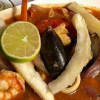 Sudado De Mariscos · Mix seafood stew Peruvian style with white rice.