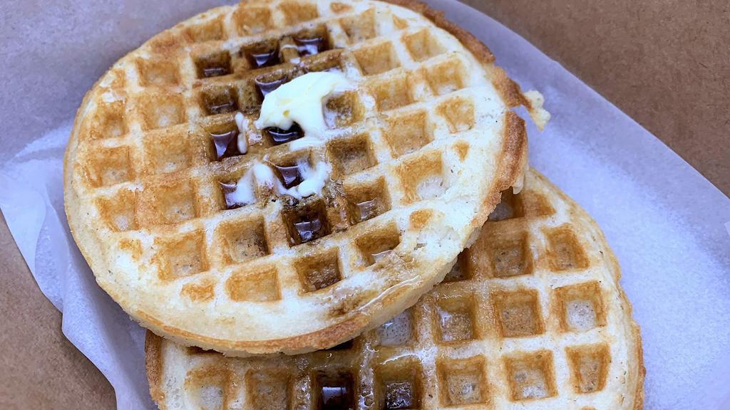 Whole Grain Waffles · Gluten free, Dairy free, Vegan. 
Served with vegan butter and a drizzle of maple syrup.