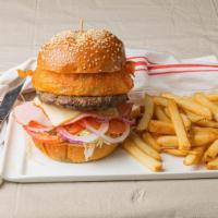 Gaucho Cubano Burger · Ground Argentinean beef topped with roast pork, smoked ham, melted cheese, pickles, and chim...