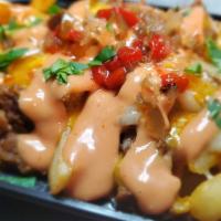 Boriqua Fries · Cheese Fries Topped with Pulled Pernil (Roast Pork) and Spicy Mayo-Ketchup