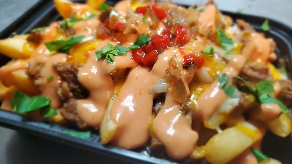 Boriqua Fries · Cheese Fries Topped with Pulled Pernil (Roast Pork) and Spicy Mayo-Ketchup
