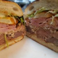 Puerto Rico Famous Tripleta
 · Roast pork, ham, and pepper steak topped with fries, Swiss cheese, lettuce, tomato, and spic...