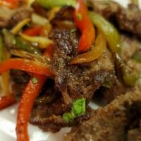 Filete A La Pimienta (Pepper Steak) · Sirloin steak tips with onions and peppers.