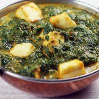 Saag Paneer · Flavorful blend of spinach and cheese. Served with basmati rice on side.