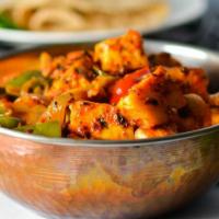Kadai Paneer · Paneer cooked with onion & bell pepper in semi dry gravy.Served with basmati rice on side.