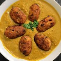 Malai Kofta · Cottage cheese and veg dumpling simmered in cashew gravy. Served with basmati rice on side.