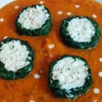 Shaam Savera · Spinach kofta stuffed with malai paneer and served in tomato gravy. Served with basmati rice...