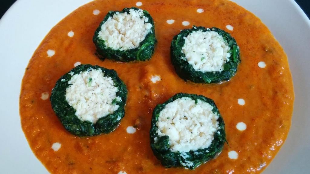 Shaam Savera · Spinach kofta stuffed with malai paneer and served in tomato gravy. Served with basmati rice on side.