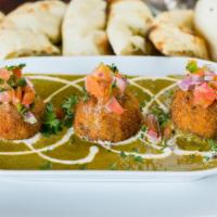 Spinach Kofta Curry · Cottage cheese and spinach dumpling simmered in spinach sauce. Served with basmati rice on s...