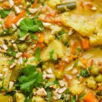 Navaratan Korma · A melange of vegetables cooked in a mild sauce.Served with basmati rice on side.