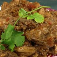 Karahi Goat · Goat with spiced with curry, bell pepper, onion, tomato, and ginger. Served with basmati ric...