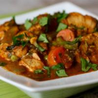 Fish Mouilli Curry · South Indian speciality fish curry. Served with basmati rice on side.