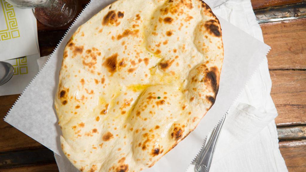 Naan · Bread made with white flour baked in tandoor.