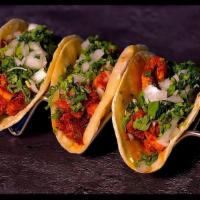 Taco · Corn Tortillas with Choice of Meat Onions, Cilantro and Our Homemade Green/Red Sauce