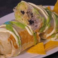 Burrito
 · Meat, Pinto Beans, Shredded Jack Cheese, Sour Cream, Rice and Homemade Salsa Wrapped in a La...
