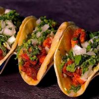 Mini Taco Trio
 · Corn Tortillas With Choice Of Meat, Onions, Cilantro and Our Homemade Salsa Verde & Salsa Roja