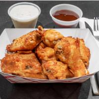 Buffalo Fried Chicken
 · Crispy buffalo wings mild add sauce optional fries sold separately.