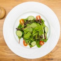 Organic Mixed Green Salad · Fresh green salad with homemade onion dressing.