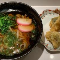 Tempura Udon · Thick wheat noodle in hot soup with shrimp and vegetables tempura.