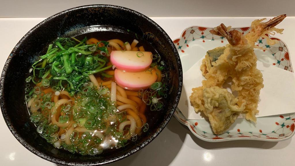 Tempura Udon · Thick wheat noodle in hot soup with shrimp and vegetables tempura.