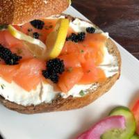 Black Pearl · Bagel plate (open bagel) with cream cheese, salmon, black caviar, tomatoes, cucumbers and on...