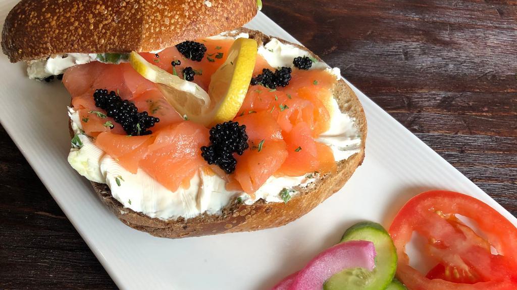 Black Pearl · Bagel plate (open bagel) with cream cheese, salmon, black caviar, tomatoes, cucumbers and onions.