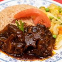 Oxtail · Served with rice and peas or with white rice or with ground provision