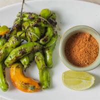 Blistered Shishito Peppers · Vegetarian, vegan, gluten free, dairy free. Ravida lemon olive oil, sea salt & paprika spice.