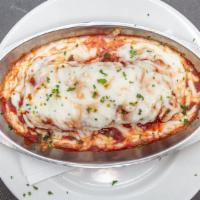 Meat Lasagna · Served with minestrone, soup of the day, or Italian mixed green salad.