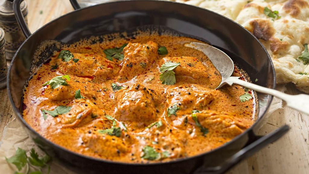 Curry Chicken · 1/2 lb of tender chicken cooked in a hearty curry spiced with Jamaican herbs and flavours.