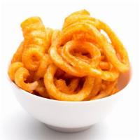 Curly Fries · Crispy golden seasoned curly fries.