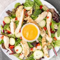 Grilled Chicken Salad · Mix of iceberg and romaine lettuce with tomatoes, carrots, onions, peppers, cucumber and gri...