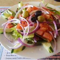 Greek Salad · Mix lettuce, tomatoes, cucumbers, onions, pepperoncini, feta cheese & Kalamata olives