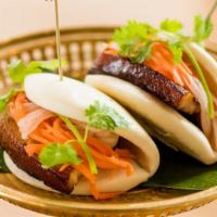Pork Bun · Five spices and xo wine braised pork belly, pickled daikon and carrots, hoisin sauce and gar...