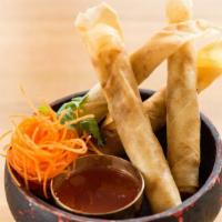 Crispy Spring Roll · Carrots, cabbage and taro folded in vermicelli. Served with sweet pomegranate & plum vinaigr...