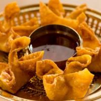 Crab Rangoon · Crispy fried kani & cream cheese wontons served with sweet chili dipping sauce.