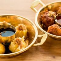 Chicken Dumpling · Minced chicken dumplings. Choose between steamed served with soy vinaigrette or crispy fried...