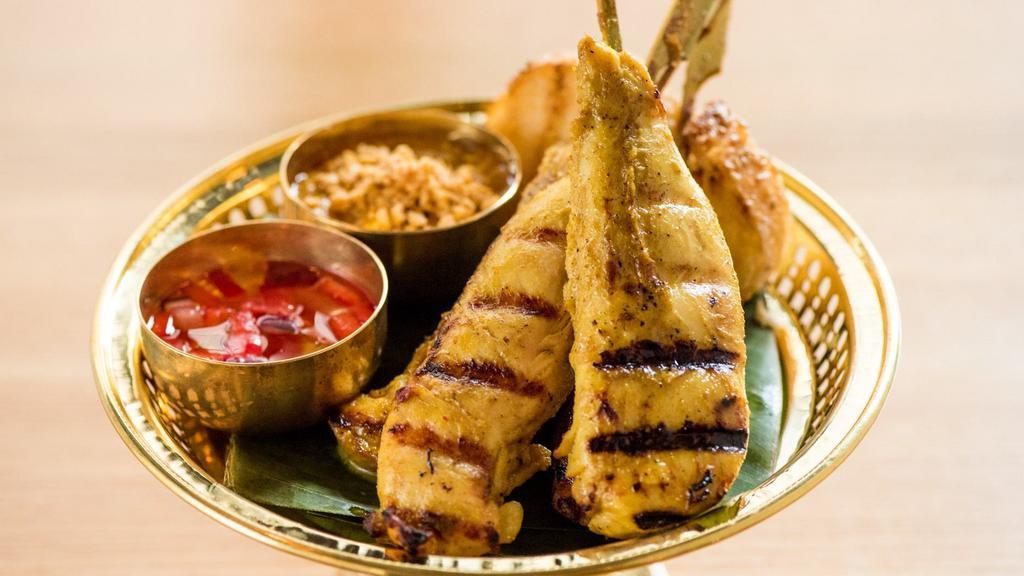 Chicken Satay · Grilled marinated chicken served with our creamy peanut sauce and cucumber vinaigrette dipping sauce.