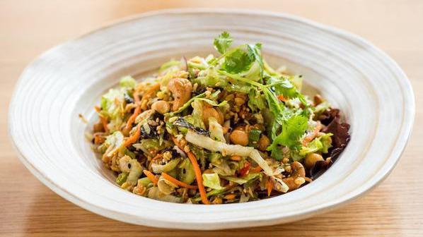 Tea Leaves Salad · Gluten-free. Laphet citrus green tea leaves, mixed nuts, sesames, fried garlic, fried red onions, scallion, cilantro, lettuce, and chili lime dressing.