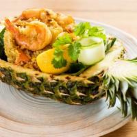 Pineapple Fried Rice · Jasmine rice stir fried with pineapple, onions, scallions, tomatoes, carrots, raisins, curry...