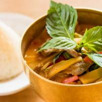 Red Curry · Spicy level 2. Bell peppers, bamboo shoots, Thai basil, in creamy coconut and red chili curr...